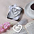  "Love Story" segnalibro a forma di cuore in metallo con favore matrimonio nappa
